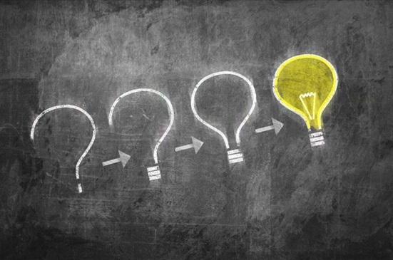 Graphic showing chalk drawn question marks and light bulbs