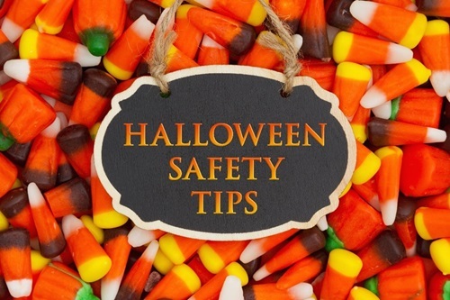 Halloween candy corn with text reading Halloween safety ttps on top