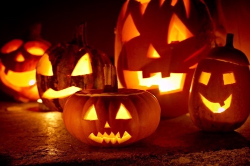 Halloween pumpkins carved with spooky faces
