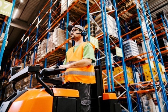 Warehouse worker on forklift